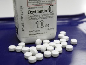 In this Feb. 19, 2013 file photo, OxyContin pills are arranged for a photo at a pharmacy in Montpelier, Vt.