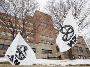 CSN flags placed outside the Montreal General Hospital during a protest against MUHC mismanagement and cutbacks in Montreal on Wednesday, February 13, 2013.