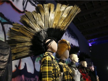 Dresses and hairstyles of the "Punk Cancan" collection are displayed during the exhibition devoted to French fashion designer Jean Paul Gaultier on March 30, 2015 in Paris. Jean Paul Gaultier exhibition is at the grand Palais from April , to August 3, 2015.