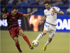 The Impact's Ignacio Piatti, right, and Alajuelense's Kenner Gutierrez fight for the ball during CONCACAF Champions League semifinal action at Montreal's Olympic Stadium on March 18, 2015.