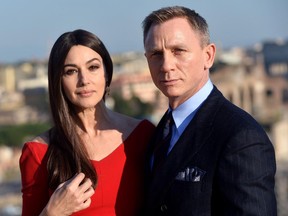 Italian actress Monica Bellucci and British actor Daniel Craig pose during a photocall to promote the 24th James Bond film Spectre on February 18, 2015 at Rome's city hall.