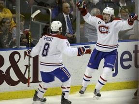 Montreal Canadiens left wing Jacob De La Rose celebrates with right wing Brandon Prust (8) after scoring a goal during the second period Tuesday, March 17, 2015,  in Sunrise, Fla.