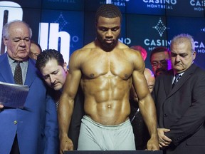 Light heavyweight challenger Jean Pascal takes to the scales during the weigh-in in Montreal, Friday, March 13, 2015, ahead of his title fight against champion Sergey Kovalev from Russia.
