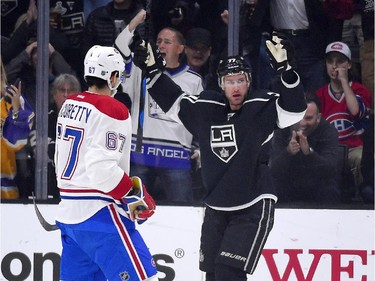 Los Angeles Kings centre Jeff Carter, right, celebrates his goal as Montreal Canadiens left wing Max Pacioretty watches during the first period of an NHL hockey game, Thursday, March 5, 2015, in Los Angeles.