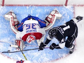 Los Angeles Kings right wing Justin Williams, right, tries to get a shot in on Montreal Canadiens goalie Dustin Tokarski during the first period of an NHL hockey game, Thursday, March 5, 2015, in Los Angeles.