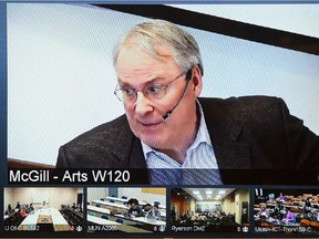 Ken Dryden is seen on a video screen at Ryerson University while leading a class via webcam from McGill University in Montreal on Thursday, March 26, 2015.