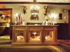 The richly furnished lounge at The INN near Jay Peak is filled with antiques and vintage curiosities.