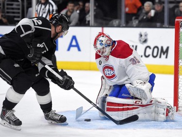 Los Angeles Kings right wing Marian Gaborik, left, of Slovakia, tries to get a shot in on Montreal Canadiens goalie Dustin Tokarski during the second period of an NHL hockey game, Thursday, March 5, 2015, in Los Angeles.