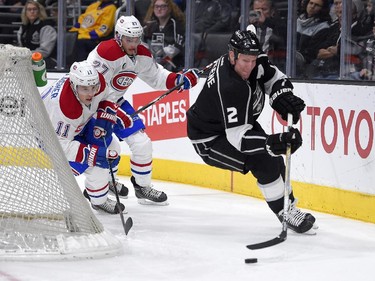 Los Angeles Kings defenceman Matt Greene, right, moves the puck as Montreal Canadiens right wing Brendan Gallagher, left, and centre Alex Galchenyuk give chase during the first period of an NHL hockey game, Thursday, March 5, 2015, in Los Angeles.