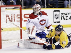 Nashville Predators defenseman Mattias Ekholm of Sweden scores a goal against Montreal Canadiens goalie Carey Price in the first period Tuesday, March 24, 2015, in Nashville, Tenn.