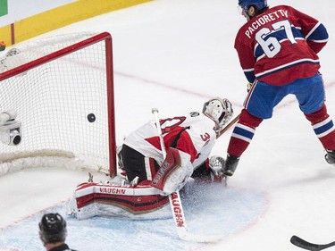 Montreal Canadiens' Max Pacioretty scores a short-handed goal past Ottawa Senators goalie Andrew Hammond during first-period action iat the Bell Centre on Thursday, March 12, 2015.