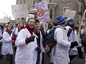 Medical students from four major Quebec universities demonstrate against Bill 20 on health, Monday, March 30, 2015 near the legislature in Quebec City.