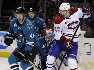 San Jose Sharks' Mirco Mueller (41) and goalie Alex Stalock get in front of a shot next to Montreal Canadiens' Dale Weise (22)  during the second period of an NHL hockey game Monday, March 2, 2015, in San Jose, Calif.