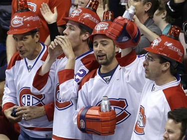 Montreal Canadiens fans celebrate after a goal scored by the Canadiens during the second period against the Florida Panthers, Tuesday, March 17, 2015,  in Sunrise, Fla.