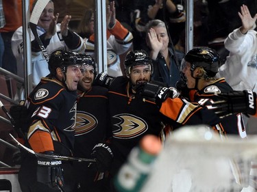 Francois Beauchemin (23) of the Anaheim Ducks celebrates his goal with Kyle Palmieri (21), Nate Thompson (44) and Hampus Lindholm (47) for a 1-0 lead over the Montreal Canadiens during the first period at Honda Center on March 4, 2015 in Anaheim, California.