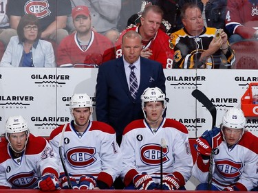Head coach Michel Therrien of the Montreal Canadiens watches from the bench during the first period of the NHL game against the Arizona Coyotes at Gila River Arena on March 7, 2015 in Glendale, Arizona.