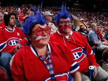 Montreal Canadiens fans, Teressa Heaton and James Heaton attend the NHL game against the Arizona Coyotes at Gila River Arena on March 7, 2015 in Glendale, Arizona.