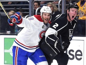 Matt Greene (2) of the Los Angeles Kings calls for a penalty as he is held by Brandon Prust (8) of the Montreal Canadiens during the first period at Staples Center on March 5, 2015 in Los Angeles, California.