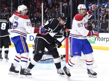 Max Pacioretty (67) of the Montreal Canadiens celebrates his goal in front of Jeff Carter (77) of the Los Angeles Kings and teammate Dale Weise (22) to take a 3-2 lead during the third period at Staples Center on March 5, 2015 in Los Angeles, California.