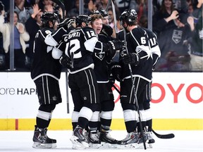 Marian Gaborik (12) of the Los Angeles Kings celebrates his goal with Tyler Toffoli (73) and the rest of his team to tie the score 3-3 with the Montreal Canadiens during the third period at Staples Center on March 5, 2015 in Los Angeles, California.