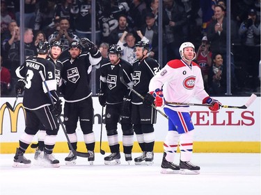 Brandon Prust (8) of the Montreal Canadiens reacts as the Los Angeles Kings celebrate a goal by Marian Gaborik (12) to take a 1-0 lead during the first period at Staples Center on March 5, 2015 in Los Angeles, California.
