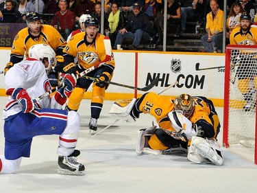David Desharnais of the Montreal Canadiens scores a goal against goalie Pekka Rinne of the Nashville Predators during the second period at Bridgestone Arena on March 24, 2015, in Nashville, Tenn.