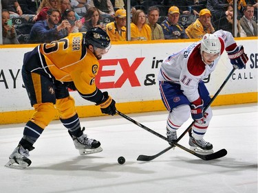 Shea Weber of the Nashville Predators slashes the stick of Brendan Gallagher of the Montreal Canadiens during the second period at Bridgestone Arena on March 24, 2015 in Nashville, Tenn.