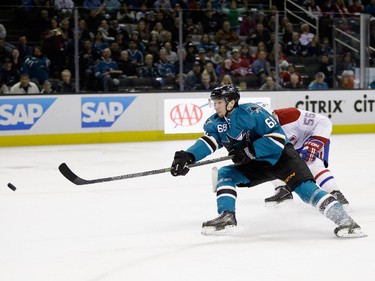 Melker Karlsson (#68) of the San Jose Sharks puts a shot on goal against the Montreal Canadiens at SAP Center on March 2, 2015 in San Jose, California.