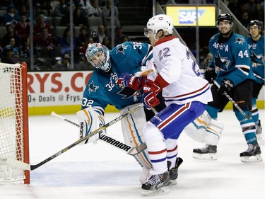 Alex Stalock (#32) of the San Jose Sharks makes a save on a shot taken by Dale Weise (#22) of the Montreal Canadiens at SAP Center on March 2, 2015 in San Jose, California.