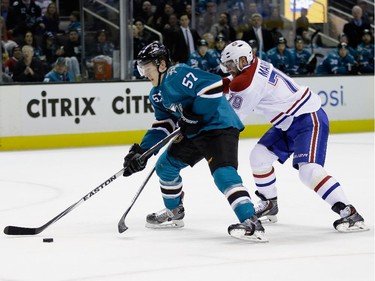 Tommy Wingels (#57) of the San Jose Sharks skates past Andrei Markov (#79) of the Montreal Canadiens at SAP Center on March 2, 2015 in San Jose, California.