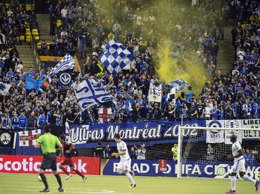 Montreal Impact fans cheer on their team as they face LD Alajuelense during second half CONCACAF soccer semi-final action Wednesday, March 18, 2015, in Montreal.