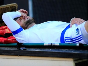 Impact midfielder Justin Mapp is carted off the field after suffering a dislocated and fractured left elbow in a 1-0 loss to D.C. United on March 7, 2015 in Washington.