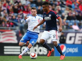 FOXBORO, MA - MARCH 21:  Jack McInerney #99 of Montreal Impact looks to steal the ball from Juan Agudelo #17 of New England Revolution  during the second half at Gillette Stadium on March 21, 2015 in Foxboro, Massachusetts.The Revolution and the Impact tied 0-0.