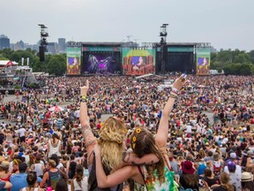 Music fans cheers during the performance by the pop rock band HAIM during the 2014 Osheaga Music Festival at Jean-Drapeau Park in Montreal on Saturday, Aug. 2, 2014.