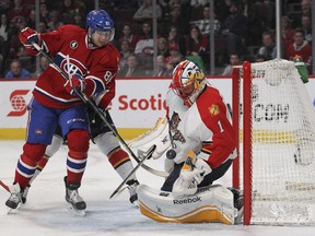 Florida Panthers goalie Roberto Luongo makes a save as the Canadiens' Lars Eller looks for the rebound during game at the Bell Centre on Feb. 19, 2015. The Panthers won 3-2 in a shootout.