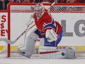 Canadiens goaltender Carey Price tosses the puck away after making shootout save against the Florida Panthers during game at the Bell Centre on Feb. 19, 2015.