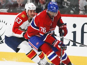 The Canadiens' P.K. Subban controls the puck despite pressure from the Florida Panthers' Dave Bolland during game at the Bell Centre on Feb. 19, 2015.