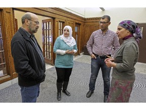 James Torczyner, left, founding director of ICAN McGill with fellows in the ICAN graduate fellowship program, Kifah Baniowed, Adnan Al Mhamied and Amal Elsana Alhjooj, right, at McGill University.