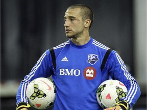 Impact goalkeeper Evan Bush takes a breather during practice at Montreal's Olympic Stadium on Feb. 27, 2015.