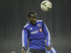 Romario Williams heads the ball during Montreal Impact practice at the Olympic Stadium in Montreal Friday February 27, 2015.