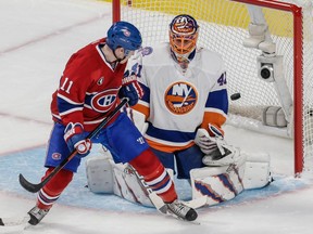 Canadiens forward Brendan Gallagher screens New York Islanders goalie Jaroslav Halak as Tomas Plekanec scores goal during game at the Bell Centre on Jan. 17, 2015. The Canadiens won 6-4.