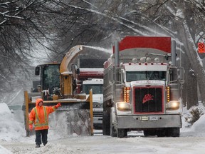 A snow removal crew works on Kensington Ave. in Montreal Wednesday, January 7, 2015.