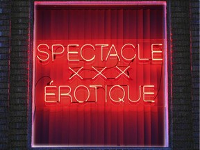 A neon sign in the window of a massage parlour in downtown Montreal, July 2012.