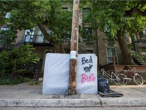 An apparently bed-bug infested mattress sits curb-side for garbage pickup on Jeanne-Mance street in the Mile-End neighbourhood of Montreal on Thursday, July 18, 2013.