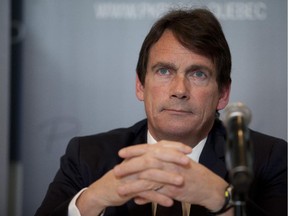 Parti Québécois leadership candidate Pierre Karl Péladeau addresses media as he announces his economic policy at a news conference in Montreal, Tuesday March 10, 2015.