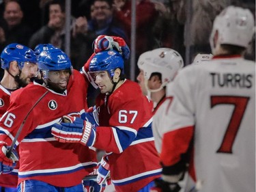 Defenseman P.K. Subban, left, congratulates teammate left wing Max Pacioretty after he scored the Canadiens second goal against the Ottawa Senators at the Bell Centre on Thursday, March 12, 2015.