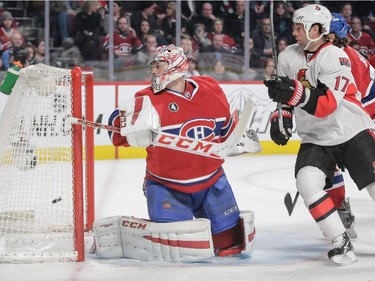 Carey Price is scored on by Ottawa Senators defenseman Marc Methot, not pictured, as centre David Legwand looks on during the third period at the Bell Centre on Thursday, March 12, 2015.