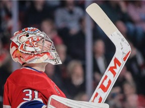 Canadiens goalie Carey Price looks up at the scoreboard after being scored on by the Ottawa Senators' Erik Karlsson during game at the Bell Centre in Montreal on March 12, 2015. The Senators won 5-2.