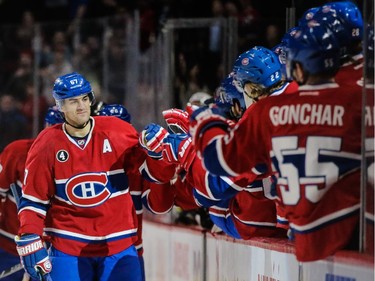 Max Pacioretty, left, is congratulated by teammates after scoring the Canadiens second goal against the Ottawa Senators at the Bell Centre on Thursday, March 12, 2015.