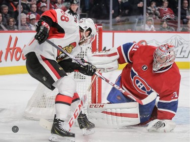 Ottawa Senators left wing Mike Hoffman attempts a shot against Carey Price during the third period at the Bell Centre on Thursday, March 12, 2015.